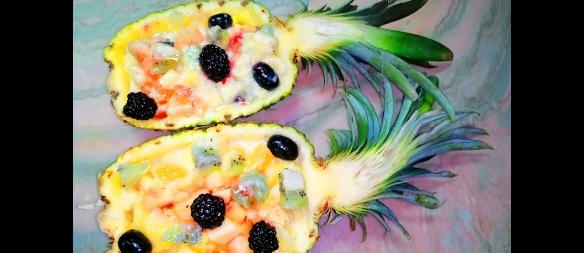 Fruits salad in pineapple. How to raise immunity tasty. Festive table. Healthy food