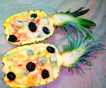 Fruits salad in pineapple. How to raise immunity tasty. Festive table. Healthy food