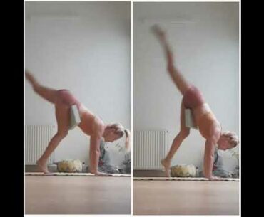 Hand stand with soft yoga block hooked between the upper thigh and the groin